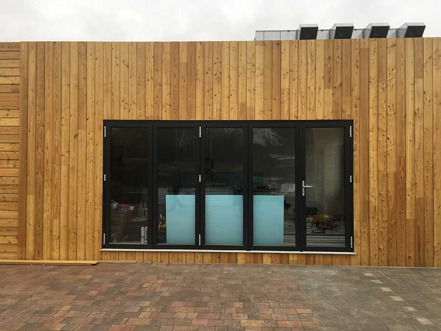 siberian larch cladding around shipping container